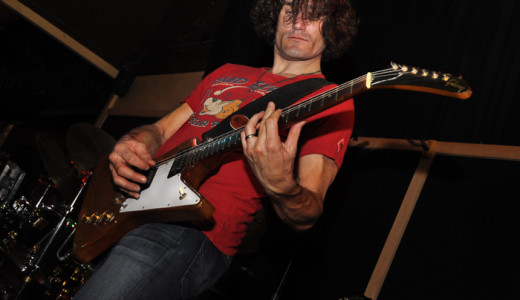 Steven Bates playing electric guitar